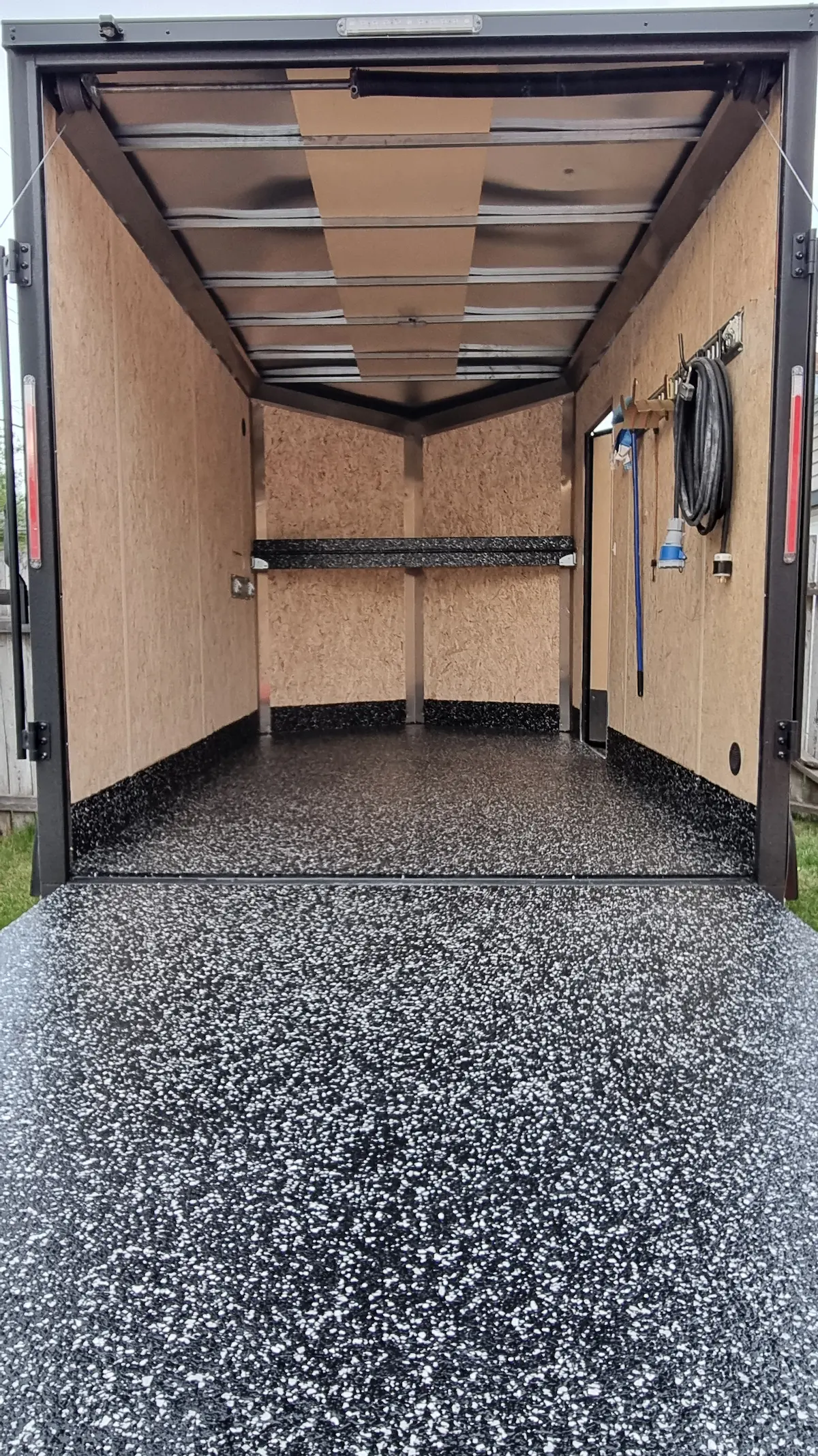 Before: Worn trailer floor before coating